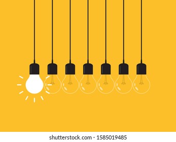 Set of hanging light bulbs with one glowing. Leadership, power and uniqueness concept.