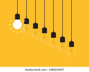 Set of hanging light bulbs with one glowing. Leadership, power and uniqueness concept.