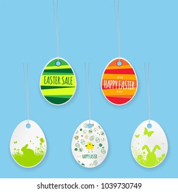 Set of hanging paper easter eggs on ropes - vector illustration