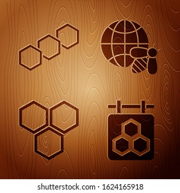 Set Hanging sign with honeycomb, Honeycomb, Honeycomb and Honeycomb map of the world and bee on wooden background. Vector