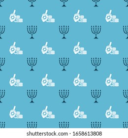 Set Hanukkah menorah and Hanukkah dreidel and coin on seamless pattern. Vector