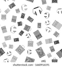 Set Headphones, Vinyl player with a vinyl disk, Music tape player and Guitar amplifier on seamless pattern. Vector