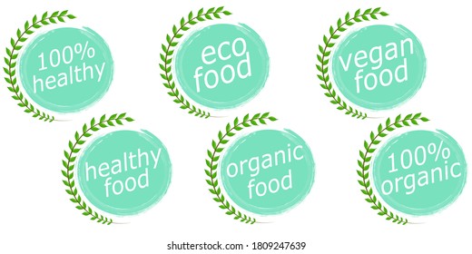 A set of healthy and organic food logos is isolated on a white background. Vector illustration in a simple flat style. Inscriptions about proper nutrition on mugs with ragged edges, near a tree branch