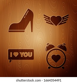 Set Heart in the center alarm clock, Woman shoe with high heel, Speech bubble with I love you and Heart with wings on wooden background. Vector