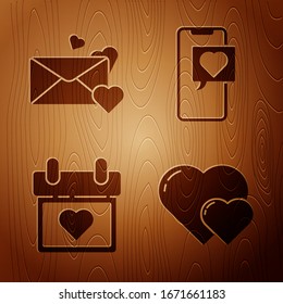 Set Heart, Envelope with heart, Calendar with heart and Smartphone with heart speech bubble on wooden background. Vector