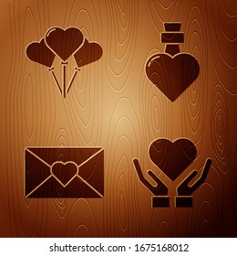 Set Heart on hand, Balloons in form of heart, Envelope with Valentine heart and Bottle with love potion on wooden background. Vector