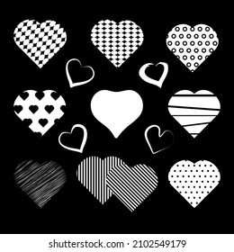 Conjunto de corazones. Elementos de diseño decorativos. Silueta blanca sobre fondo negro. Vector 