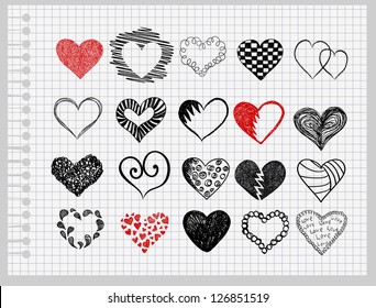 Colocar los corazones dibujados a mano en una hoja de papel en la jaula