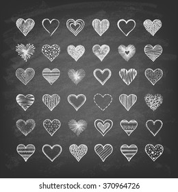 Set of hearts on the blackboard. Hand drawn. Vector illustration.
