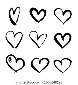 Set of hearts painted with brushes and black paint. Vector.