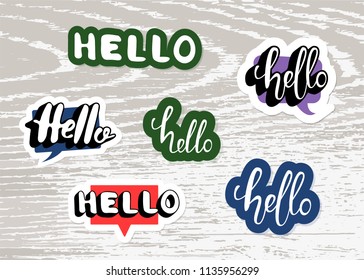 Set of Hello stickers on wood background. Hello quote elements for banner, poster, social media networks. Vector illustration.
