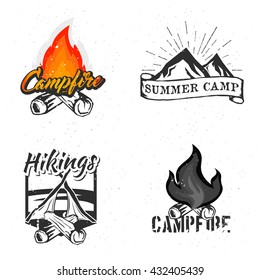 Set of hiking logos. Campfire and Summer Camp badges, labels. Bright colorful cartoon fire in logotype.