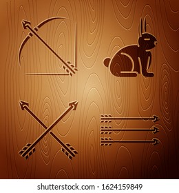 Set Hipster arrows, Bow and arrow in quiver, Crossed arrows and Rabbit on wooden background. Vector