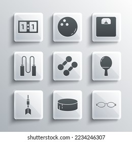 Set Hockey puck, Glasses for swimming, Racket playing table tennis, Dumbbell, Dart arrow, Jump rope, Sport mechanical scoreboard and Bathroom scales icon. Vector