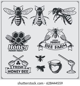 Set of honey labels, badges and design elements. Honeycombs, bees, honey emblems.