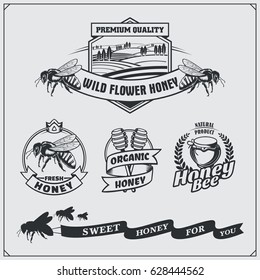 Set of honey labels, badges, emblems and design elements.