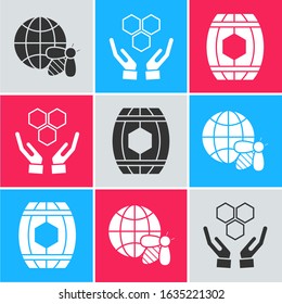 Set Honeycomb map of the world and bee, Honeycomb and hands and Wooden barrel with honey icon. Vector