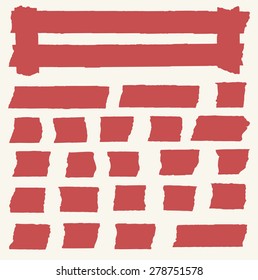Set of horizontal and different size red sticky tape, adhesive pieces on light brown background