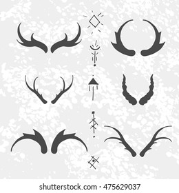 Set of horns in hand-draw style with mystical signs. Design elements on texture background.