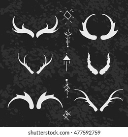 Set of horns in hand-draw style with mystical signs. Design elements on texture background.