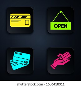 Set Human hand holding with credit card, Credit card, Credit card and Hanging sign with text Open door. Black square button. Vector