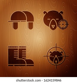 Set Hunt on bear with crosshairs, Hunter hat, Hunter boots and Hunt on bear with crosshairs on wooden background. Vector