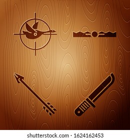 Set Hunter knife, Hunt on duck with crosshairs, Hipster arrow and Trap hunting on wooden background. Vector