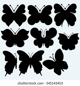Set icon butterfly. Isolated on blue background. Vector silhouettes