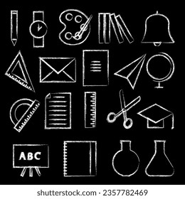 
Set of icons and images of school supplies drawn in white chalk on a black background