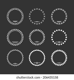 Set icons of laurel wreath and modern frames isolated on black. Vector illustration