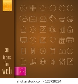 set of icons on a brown fabric