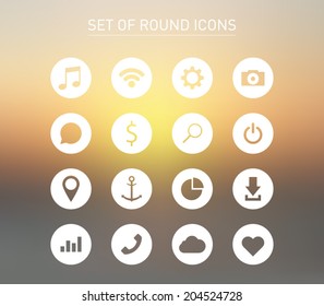Set of icons over blurred background for smartphones, tablets, devices, user interface, applications. Music, wifi, settings, camera, chat, search, map, download, cloud. Clean and modern syle design