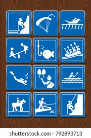 Set icons paragliding, diving, hippodrome, playground, horseback riding, rafting, hiking. Icons in blue color on wooden background. Vector image