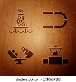 Coloque el tubo y la válvula de la industria, la plataforma de aceite con fuego, el buque petrolero naufragado y el tubo de la industria sobre fondo de madera. Vector