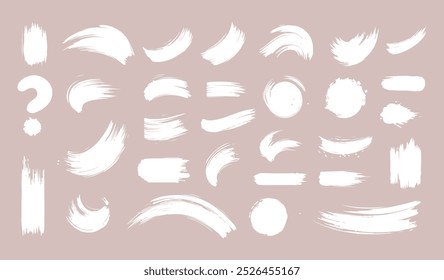 Set of Ink brush stroke silhouettes in various shapes and sizes