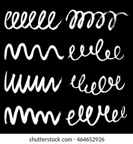 Set of ink grunge brushes on black background vector illustration