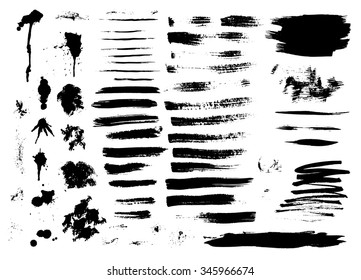 Set of ink hand drawn brush strokes, spots, blots and smudges isolated on white