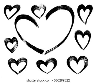 Set of ink hand drawn heart shapes made of brush strokes. Black sketch isolated on white background. For decorate, Valentine cards, greetings and invitations.