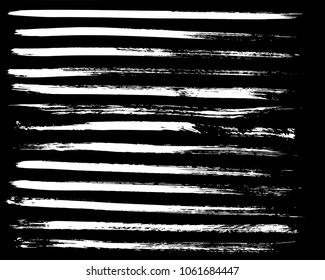 Set of ink vector stains. Grunge brush collection isolated on black