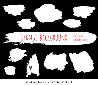 Set of ink vector stains. Grunge brush collection isolated on black