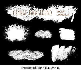 Set of ink vector stains. Grunge brush collection isolated on black
