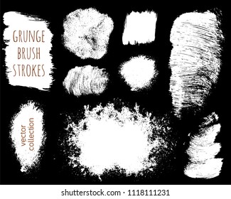 Set of ink vector stains. Grunge brush collection isolated on black