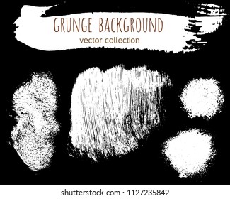 Set of ink vector stains. Grunge brush collection isolated on black