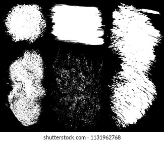 Set of ink vector stains. Grunge brush collection isolated on black