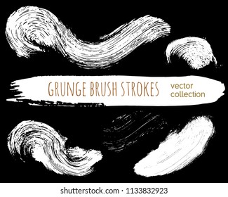 Set of ink vector stains. Grunge brush collection isolated on black