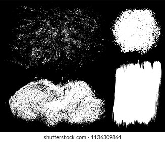 Set of ink vector stains. Grunge brush collection isolated on black
