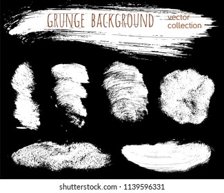 Set of ink vector stains. Grunge brush collection isolated on black