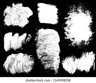 Set of ink vector stains. Grunge brush collection isolated on black