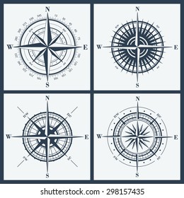 Set of isolated compass roses or windroses . Vector illustration.