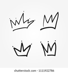 Set of isolated crowns drawn by hand. Sketch, doodle, scribble. Vector illustration.